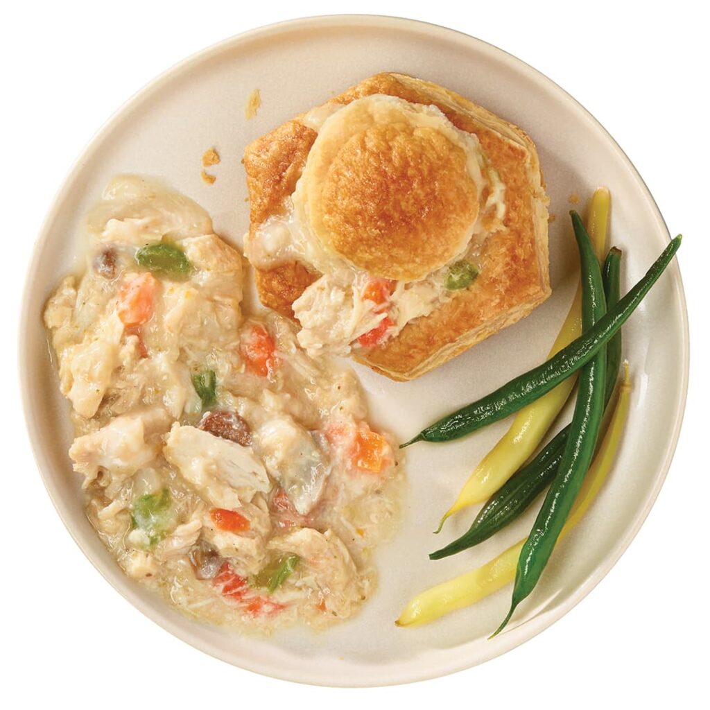 Grain-Fed Chicken Vol-au-Vent from Ferme des Voltigeurs, served in a pastry shell with beans.