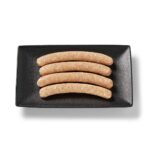 Saucisse de poulet cheddar bacon Ferme des Voltigeurs dans un plateau de présentation