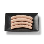 Saucisse de poulet dijonaise Ferme des Voltigeurs dans un plateau de présentation