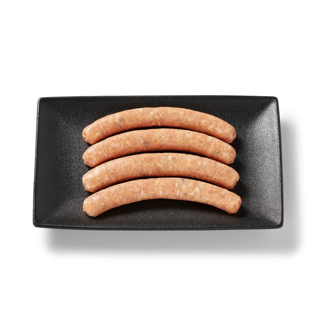 Ferme des Voltigeurs saucisses de poulet érable et bacon sur un plateau de présentation